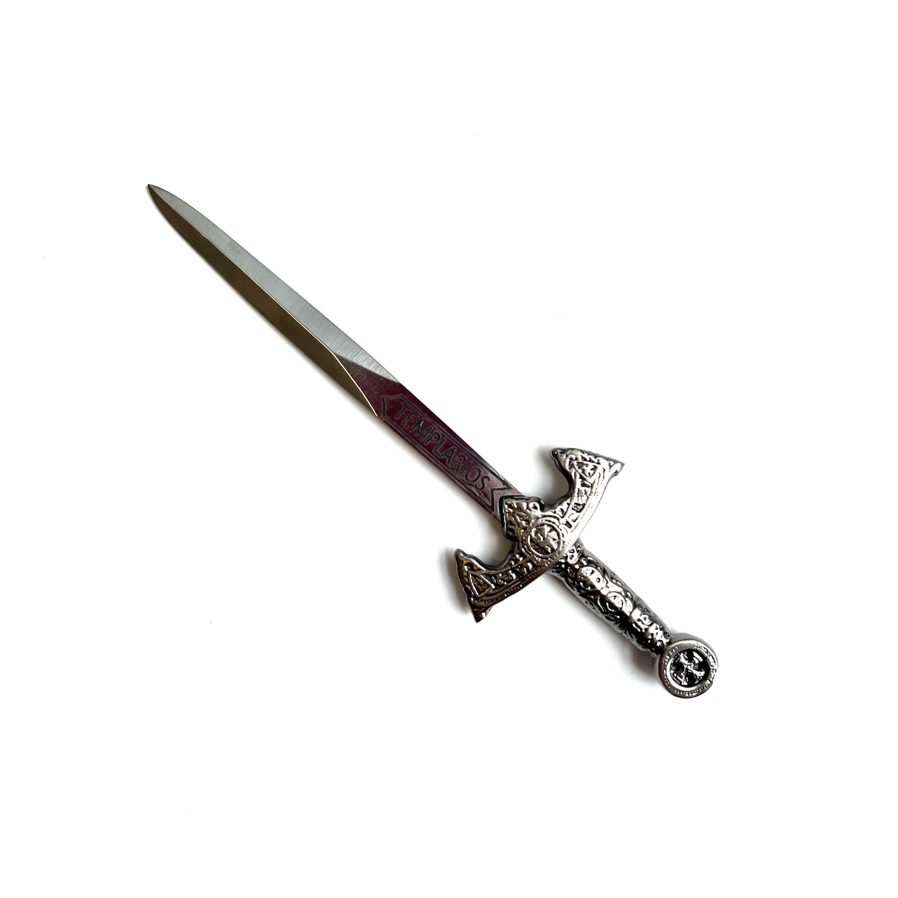 A Masonic sword with a silver blade and decorated handle, resembling a design from the Knight Templar era.