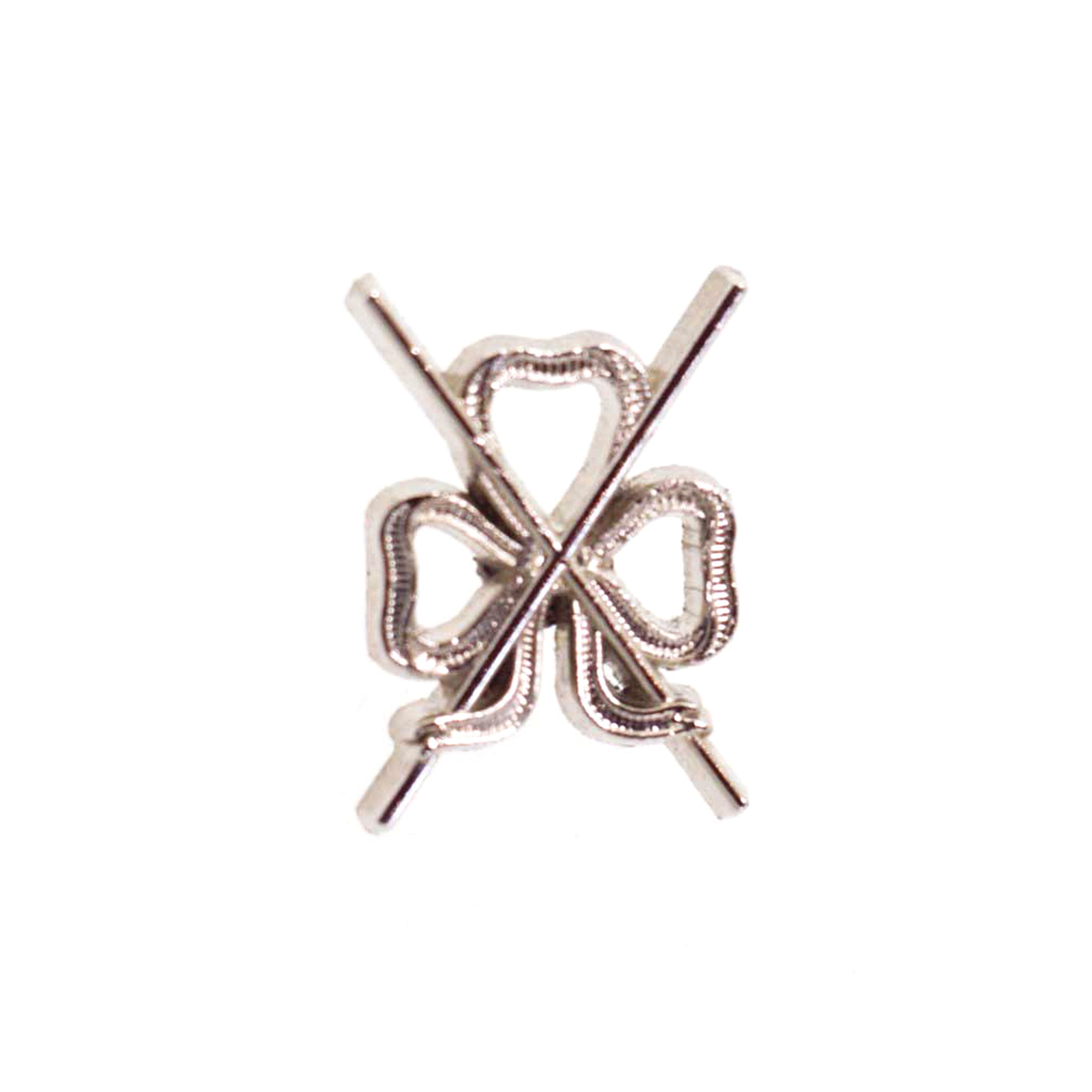 A masonic metal director of ceremonies lapel pin shaped like a house with a geometric pattern.