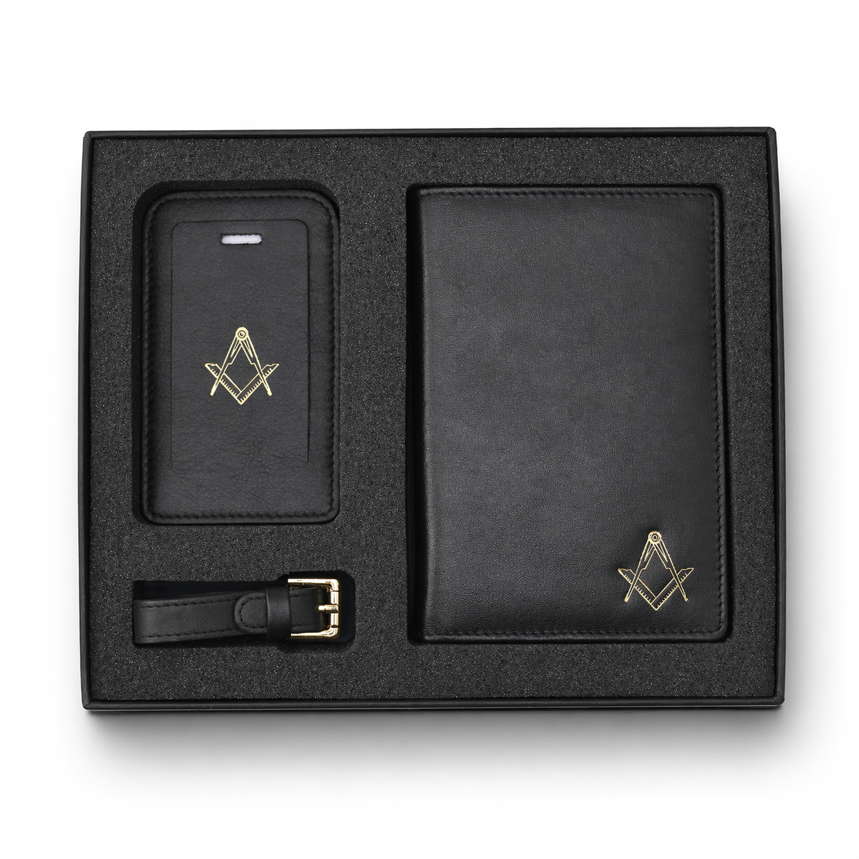 Black leather gift set in a presentation box, including a passport holder, travel wallet and a luggage tag, each featuring a gold Masonic square-and-compass emblem.