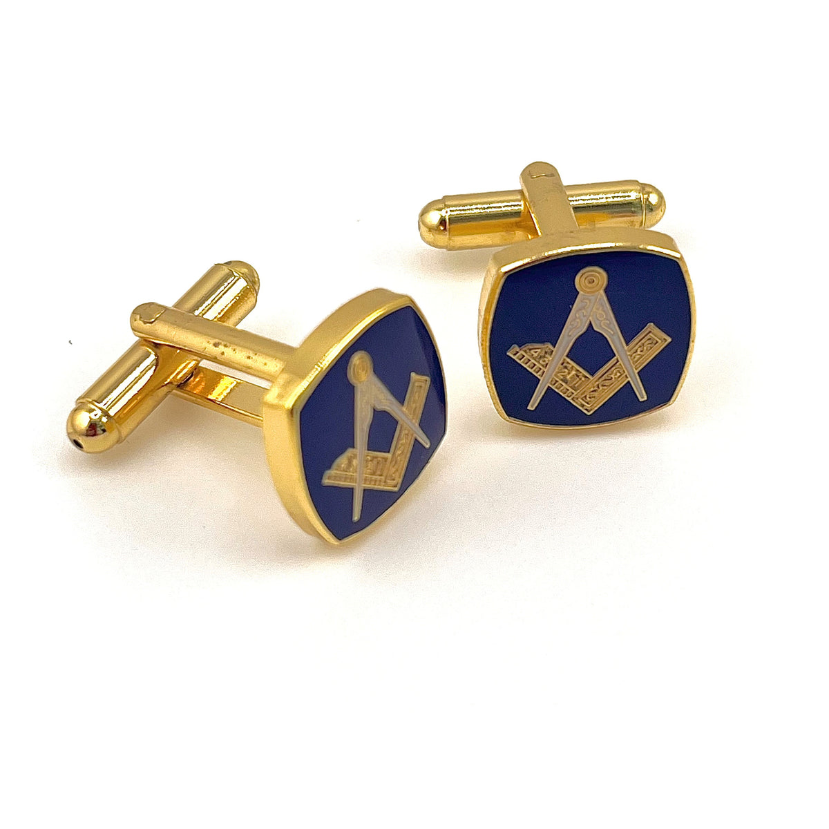 Gold and blue Masonic cufflinks on a white background