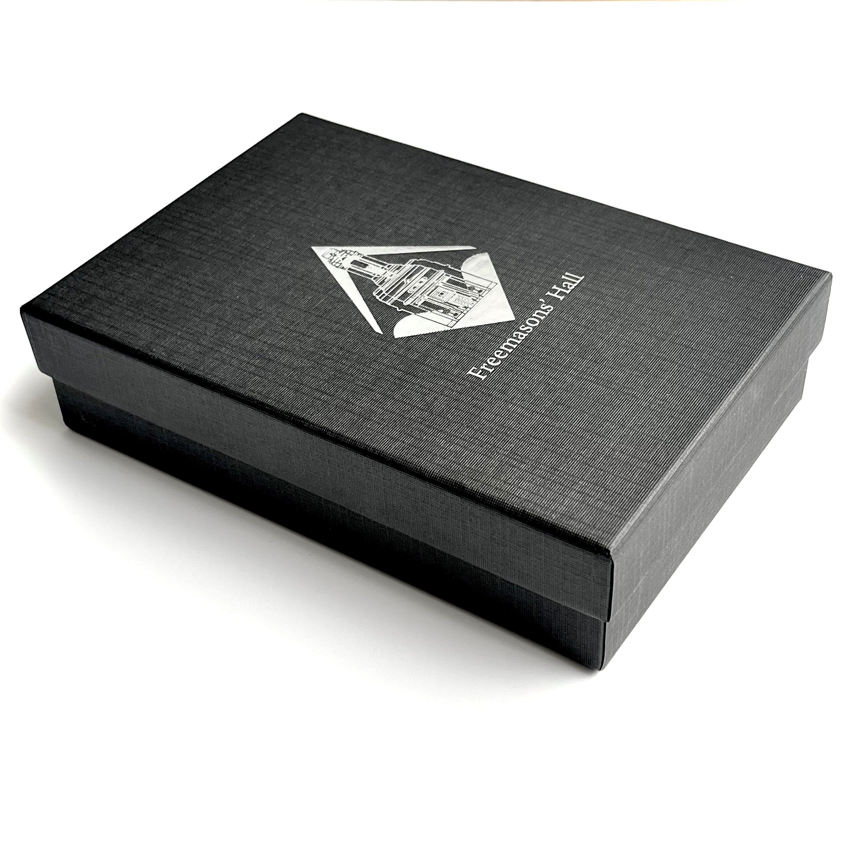 Masonic_Stainless_Steel_Hip_Flask Black box with Freemasons' Hall London logo and silver text on a white background