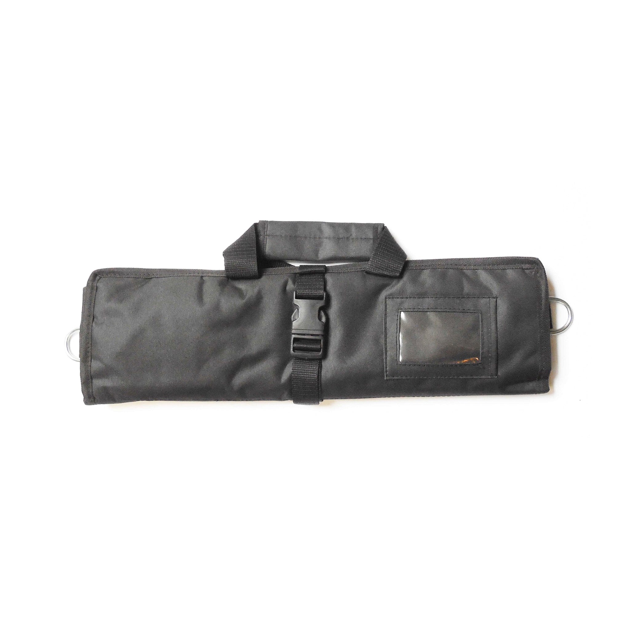 A rolled-up black cordura fabric bag with a buckle and a small rectangular tag on the side.