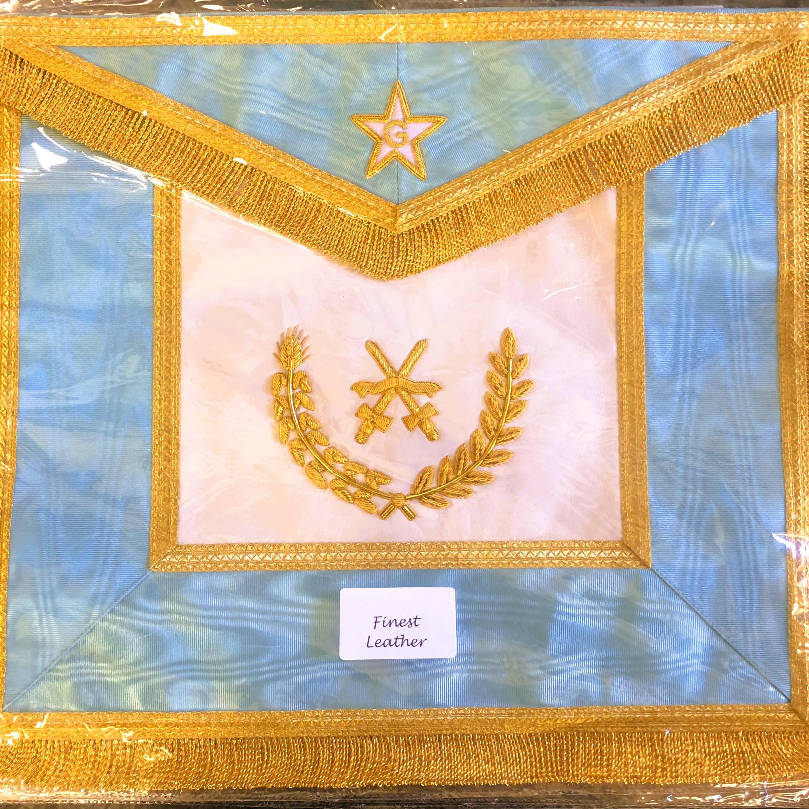Decorative Masonic Apron for the Netherlands with gold embroidery on a blue background, labeled 'Finest Leather'.