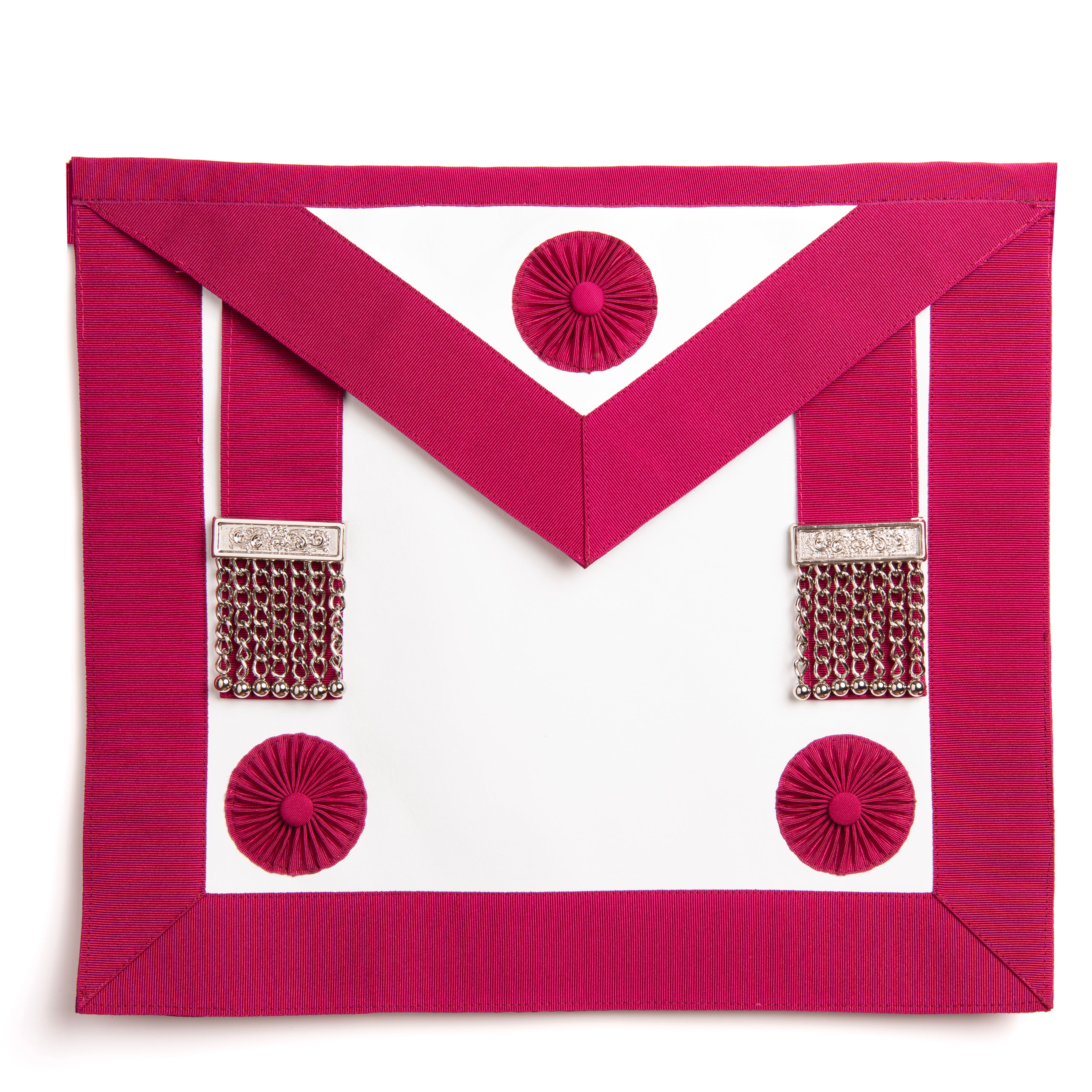 A pink masonic apron with red rosettes and decorative buttons.