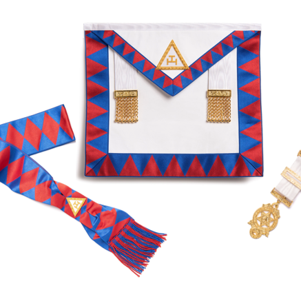 Masonic apron with red and blue border, two gold jewels, a brest jewel and a red and blue sash on a white background.