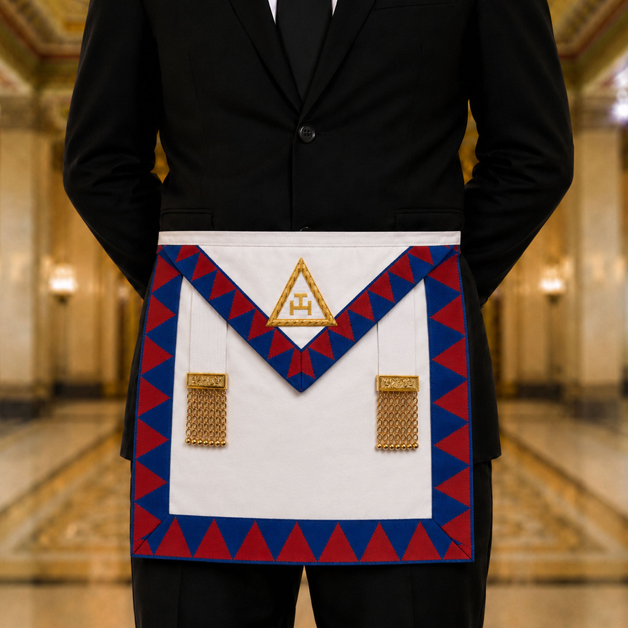 UGLE-approved Masonic Royal Arch Companion apron featuring a white front with a gold emblem, red and blue geometric patterns on the sides being worn.