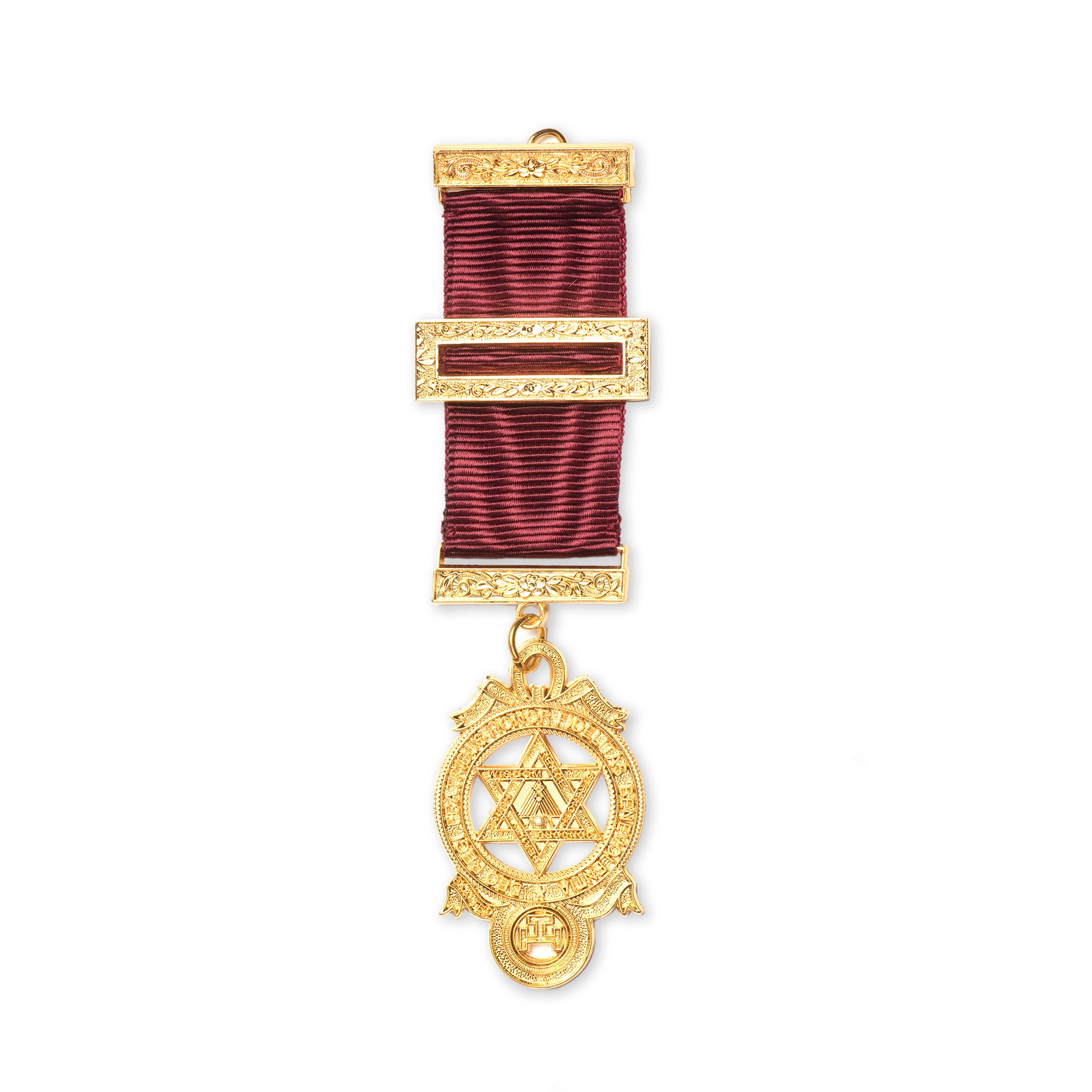 A gold-colored Masonic breast jewel with a geometric pattern and a red ribbon attachment, displaying a symbolical design.