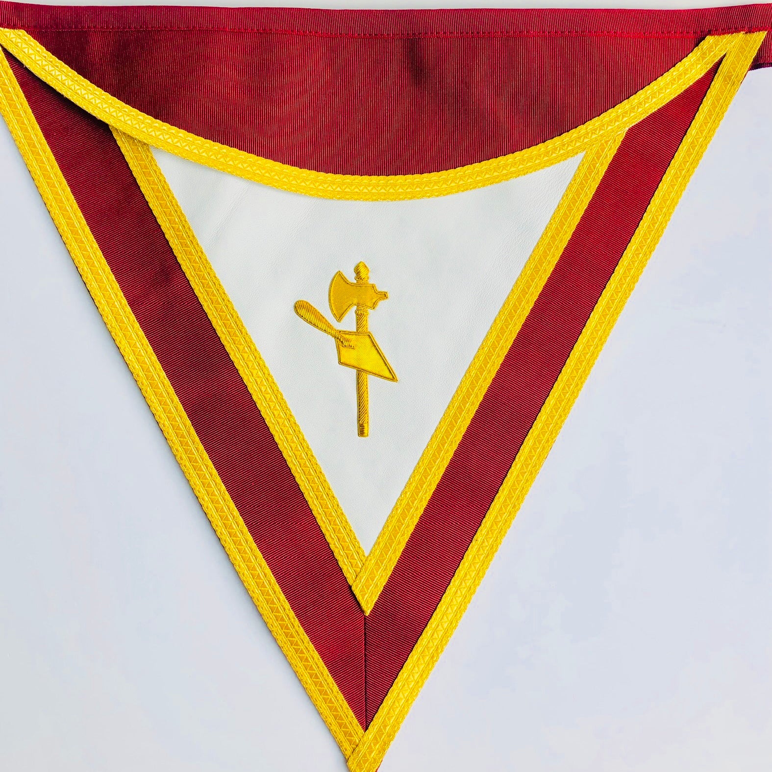 Masonic Apron wiht triangular banner style with red and yellow border and central emblem on a white background