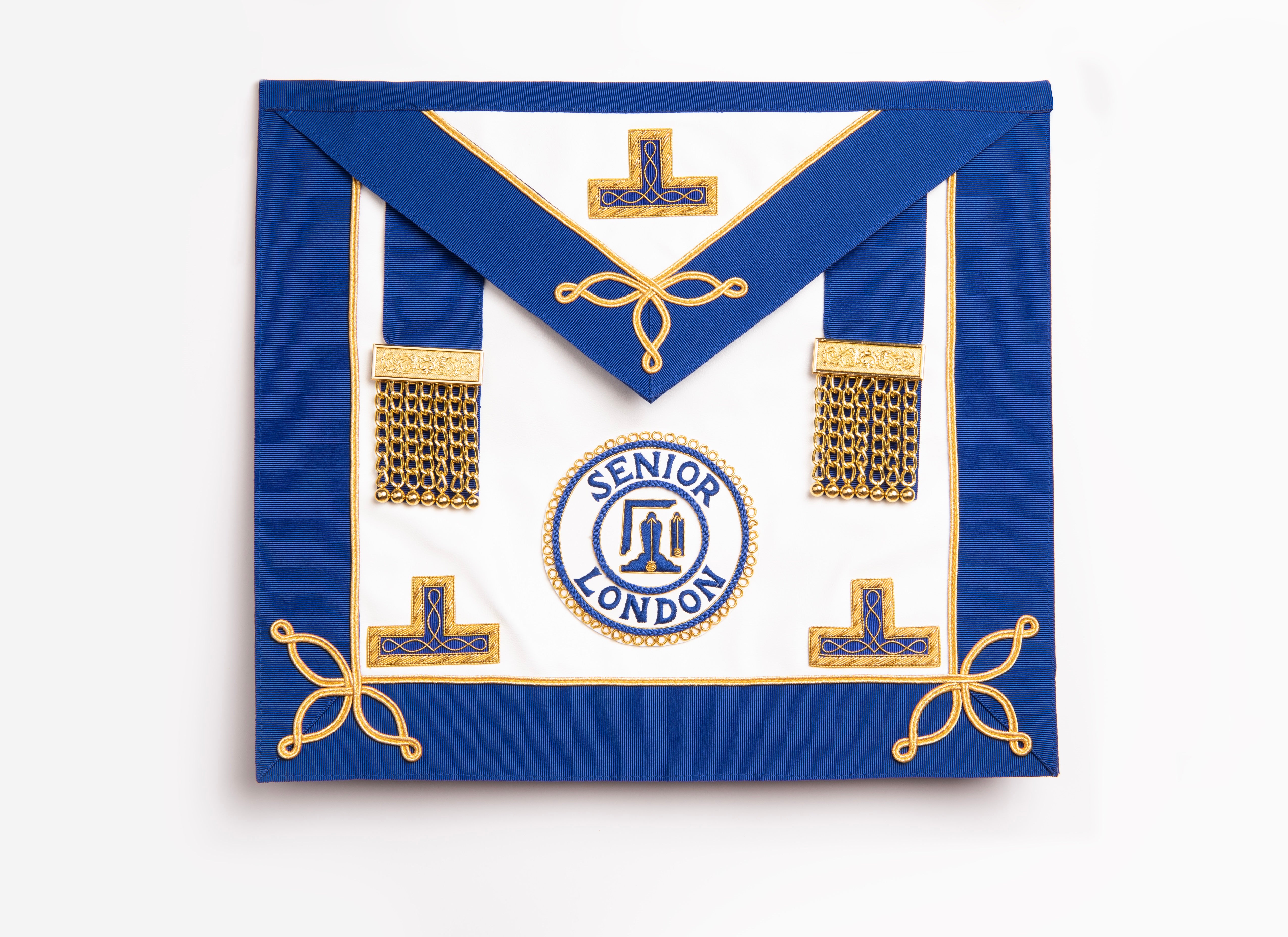 A blue and gold masonic apron with rosettes and a badge in the center.