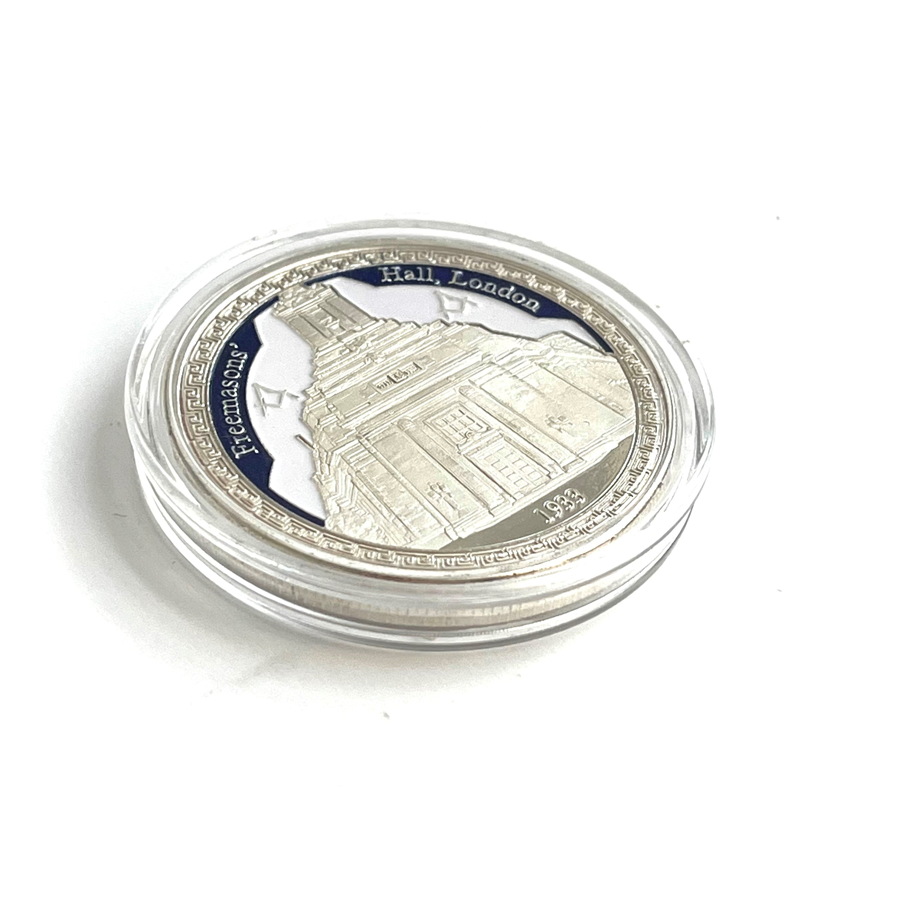 Silver Square & Compasses Freemasons' Hall Coin fron in presentation case on a white background