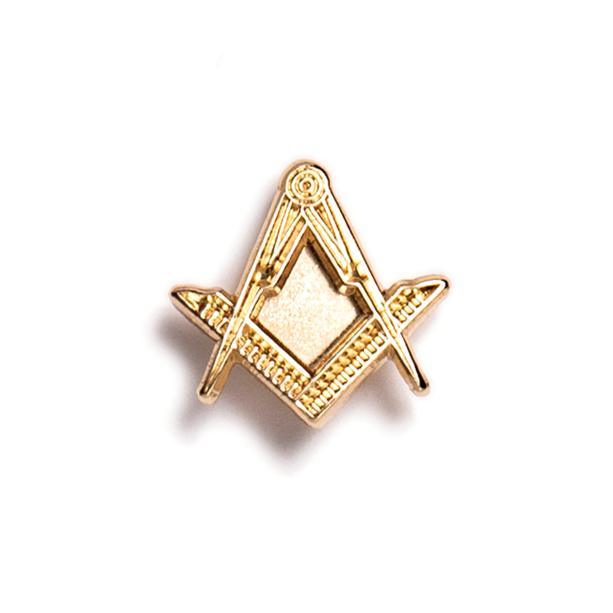 A small gold pin badge featuring the square and compasses symbol.