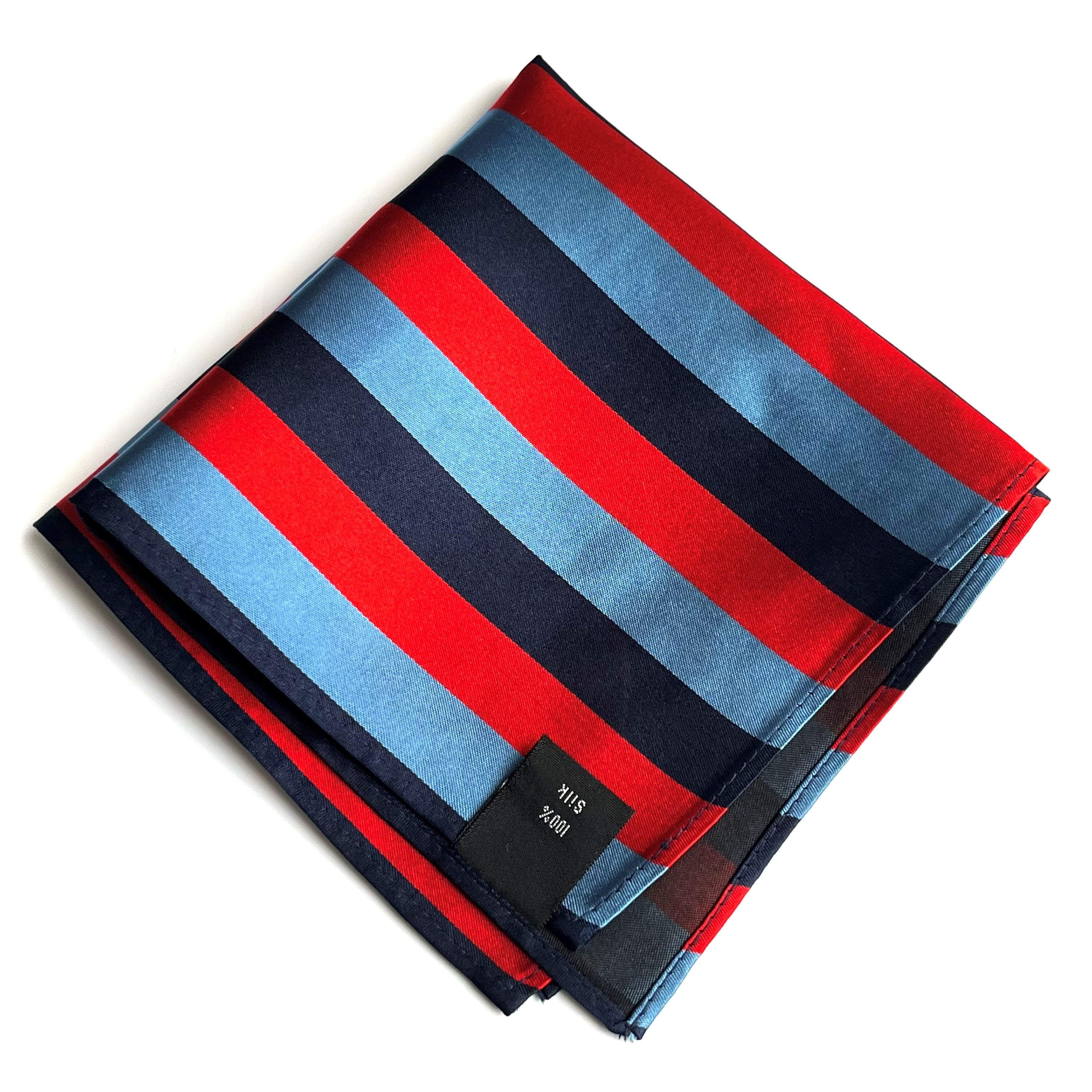 Striped One Journey Silk Handkerchief with red, blue, and black colors on a white background. 100% silk label