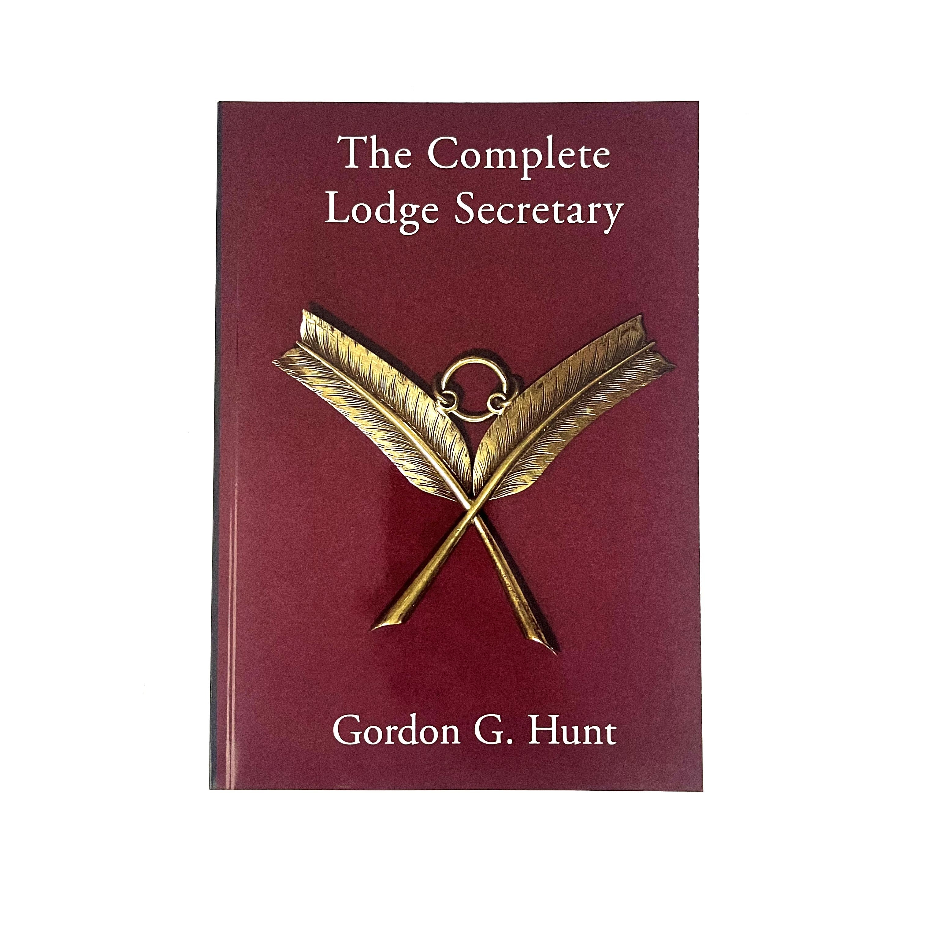 The cover of the book 'The Complete Lodge Secretary' by Gordon G. Hunt features a maroon background with a gold embossed feather design and the title of the book prominently displayed.