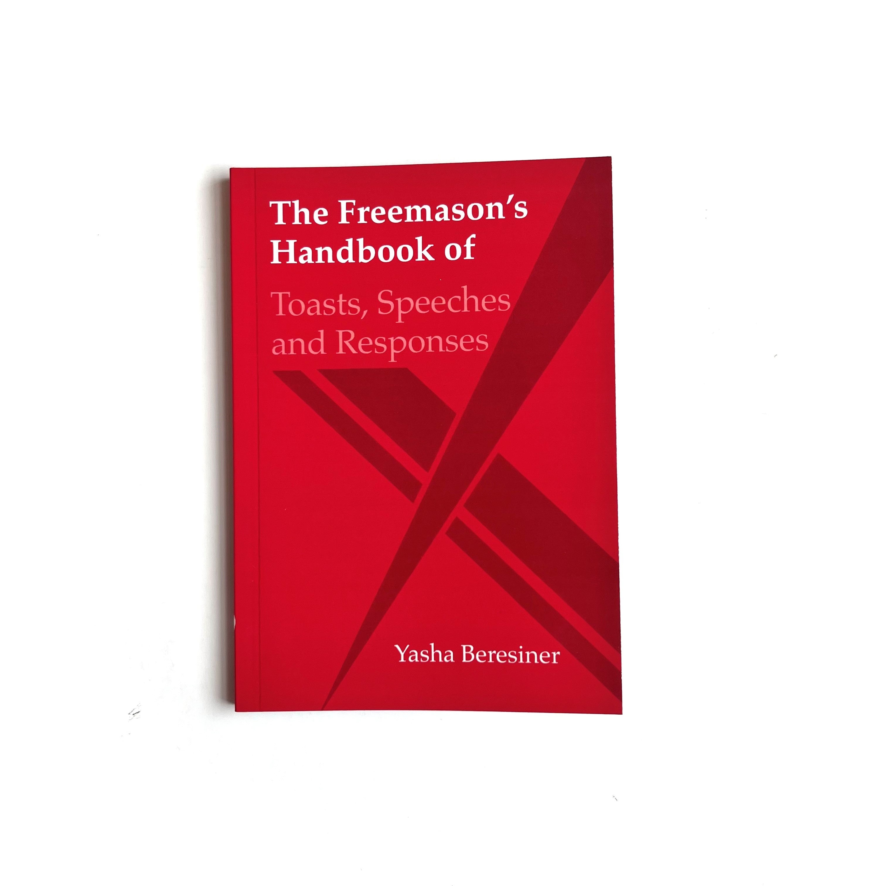 A red book titled 'The Freemason's Handbook of Toasts, Speeches and Responses' by Yasha Beresiner.