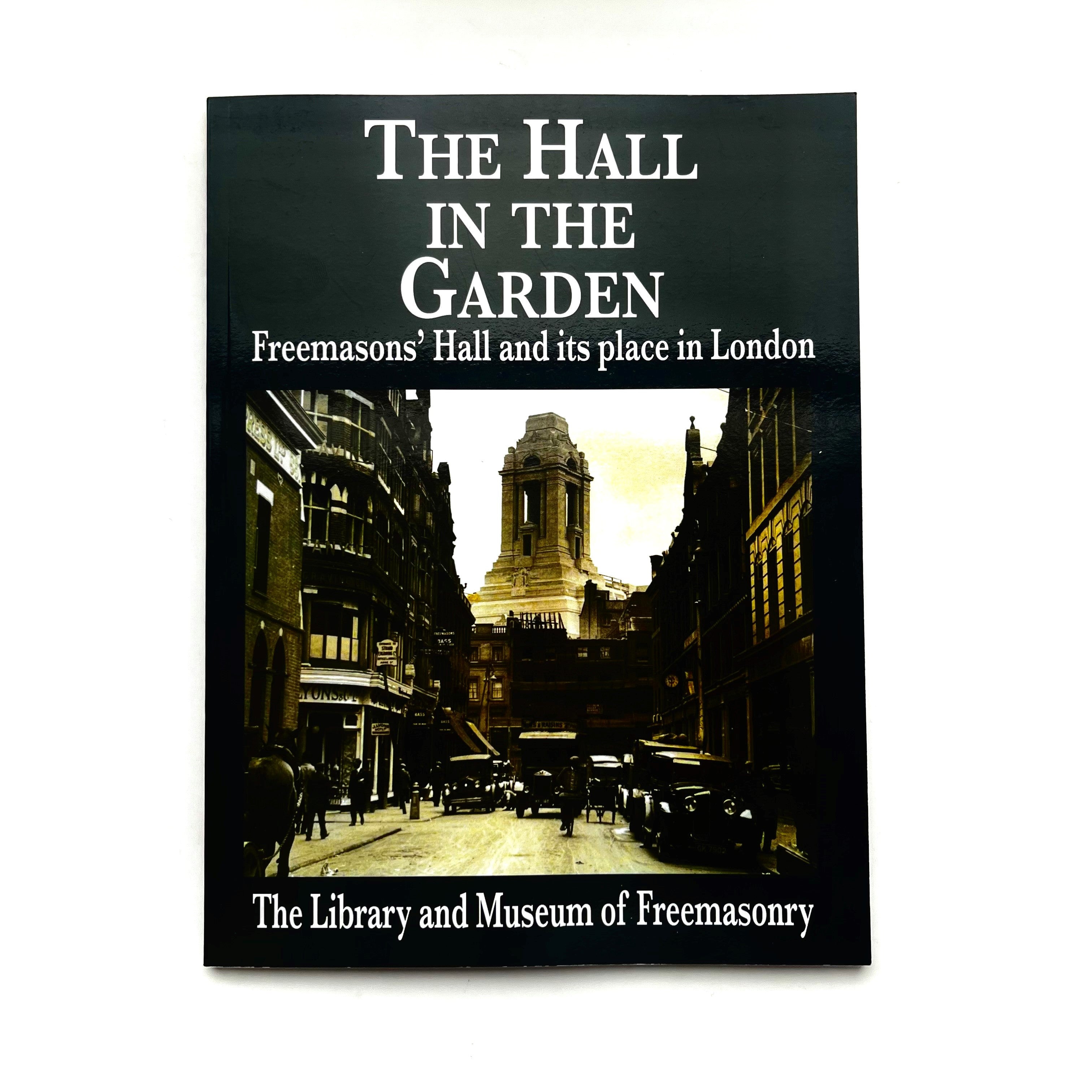 The cover of the book 'The Hall in the Garden' featuring a black and white photograph of Freemasonry Hall and its surroundings in London.