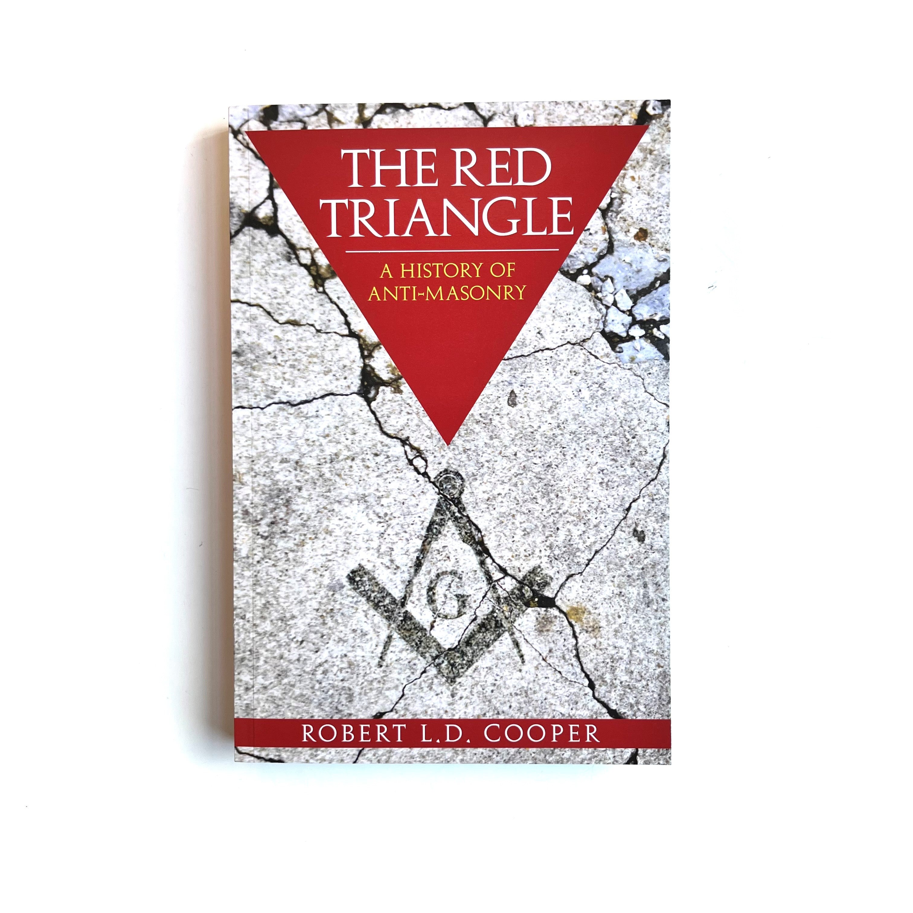 The cover of the book 'The Red Triangle: A History of Anti-Masonry' by Robert D. Cooper features a red triangle with a graphic design and text on a distressed white and gray background.