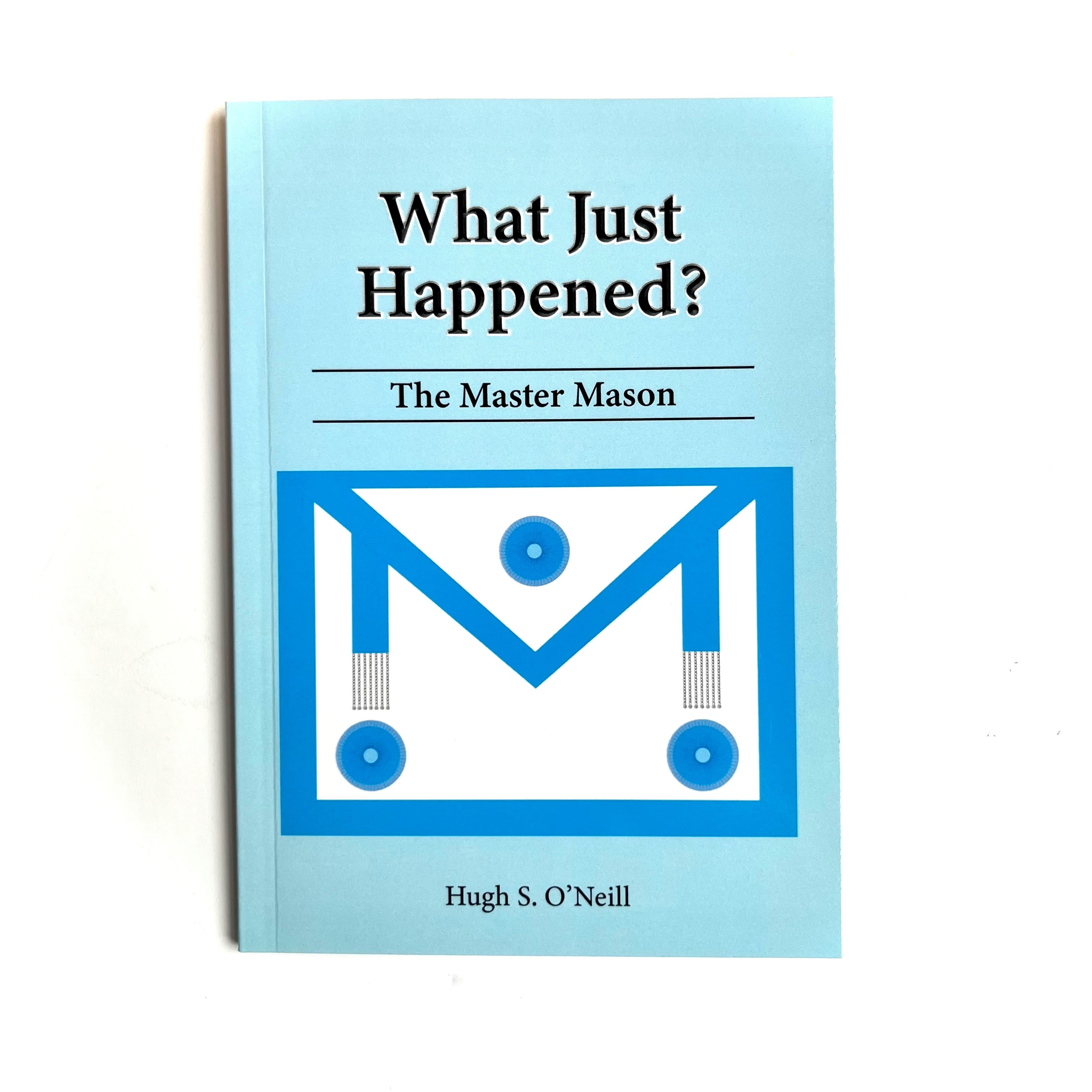 A book cover of 'What Just Happened? The Master Mason' with a blue background and a Masonic apron symbol in blue & white.