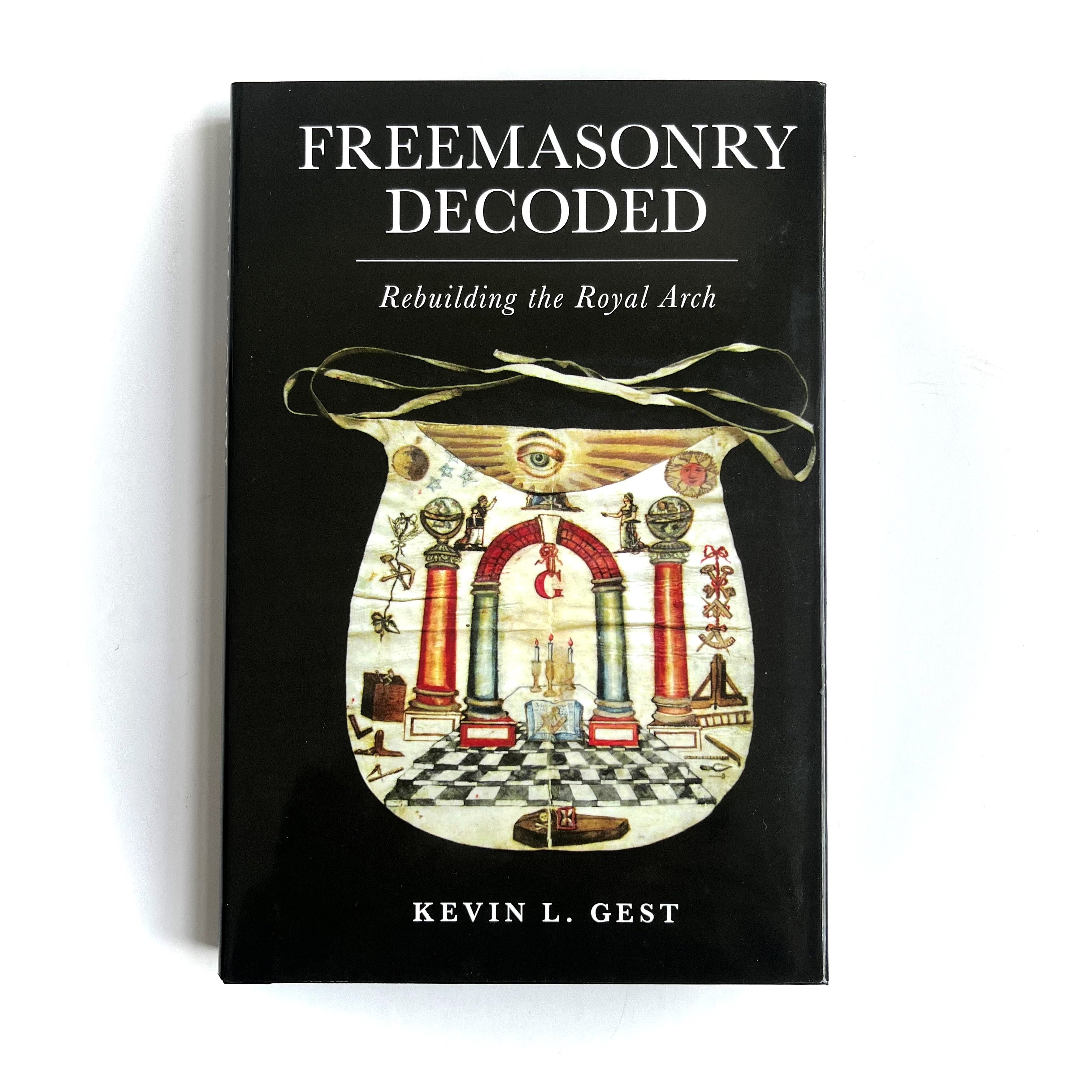 A book titled 'Freemasonry Decoded - Rebuilding the Royal Arch' by Kevin L. Gest with a Masonic emblem design on the cover.