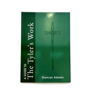 A green Masonic book titled 'A Guide To The Tyler's Work' by Duncan Adams.