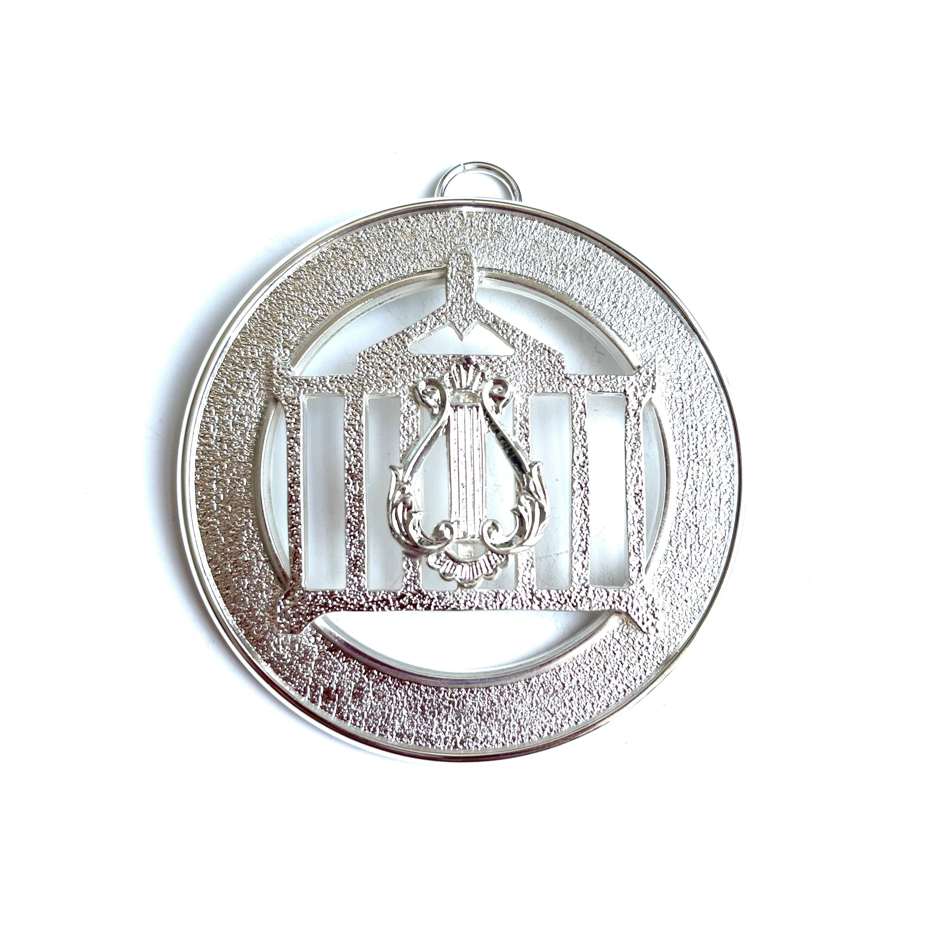 Allied Officer's Collar Jewel - Organist, silver coloured on a white background