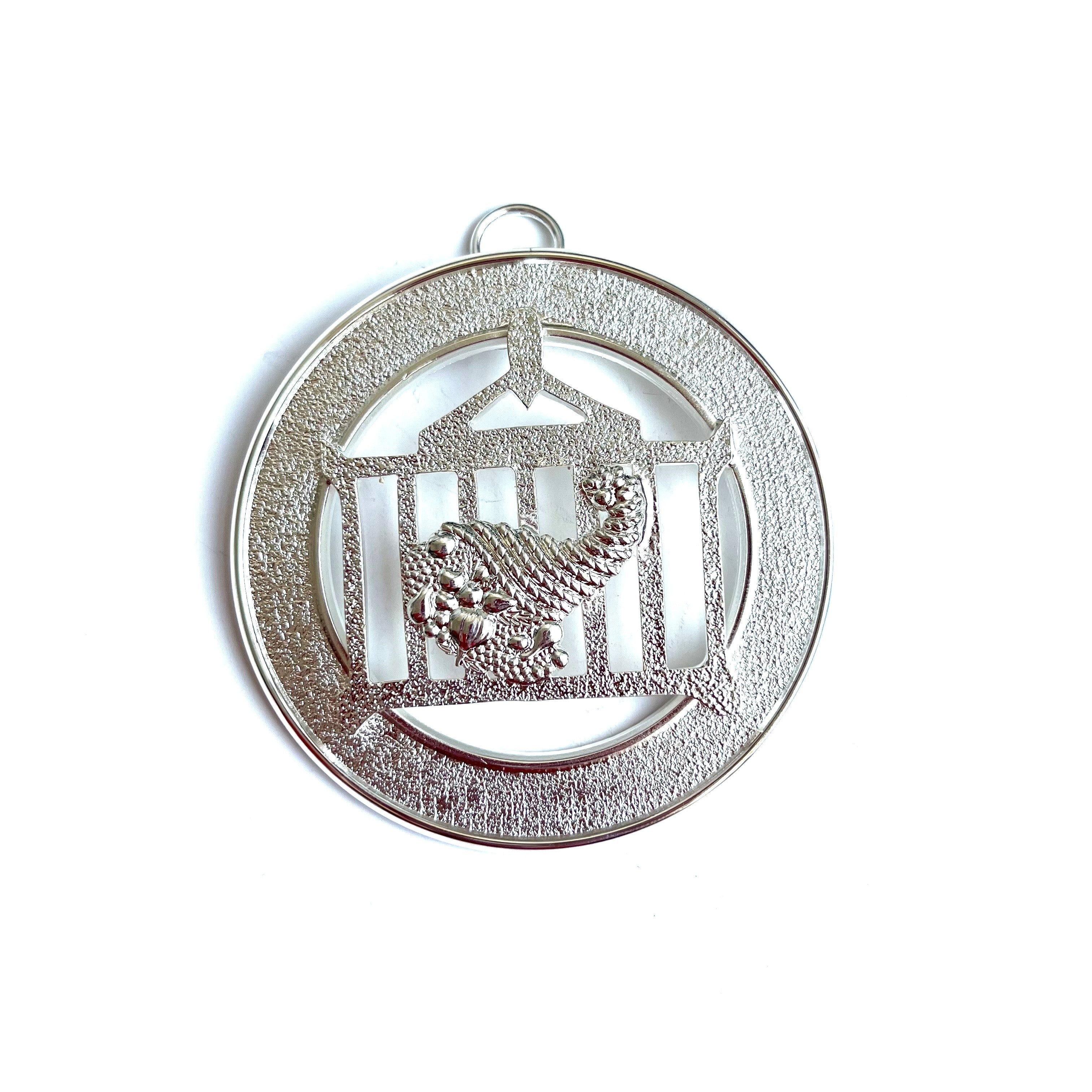 Allied Officer's Collar Jewel - Steward, silver coloured on a white background.