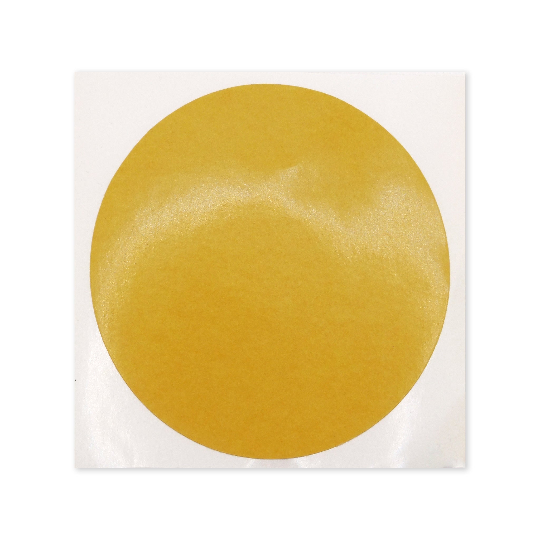 A double-sided sticky pad designed for affixing apron badges to Masonic aprons, with a gold-colored circular sticker on a white background.