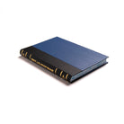 A closed Masonic Declaration Book with a blue and black hardcover and gold accents on the spine.