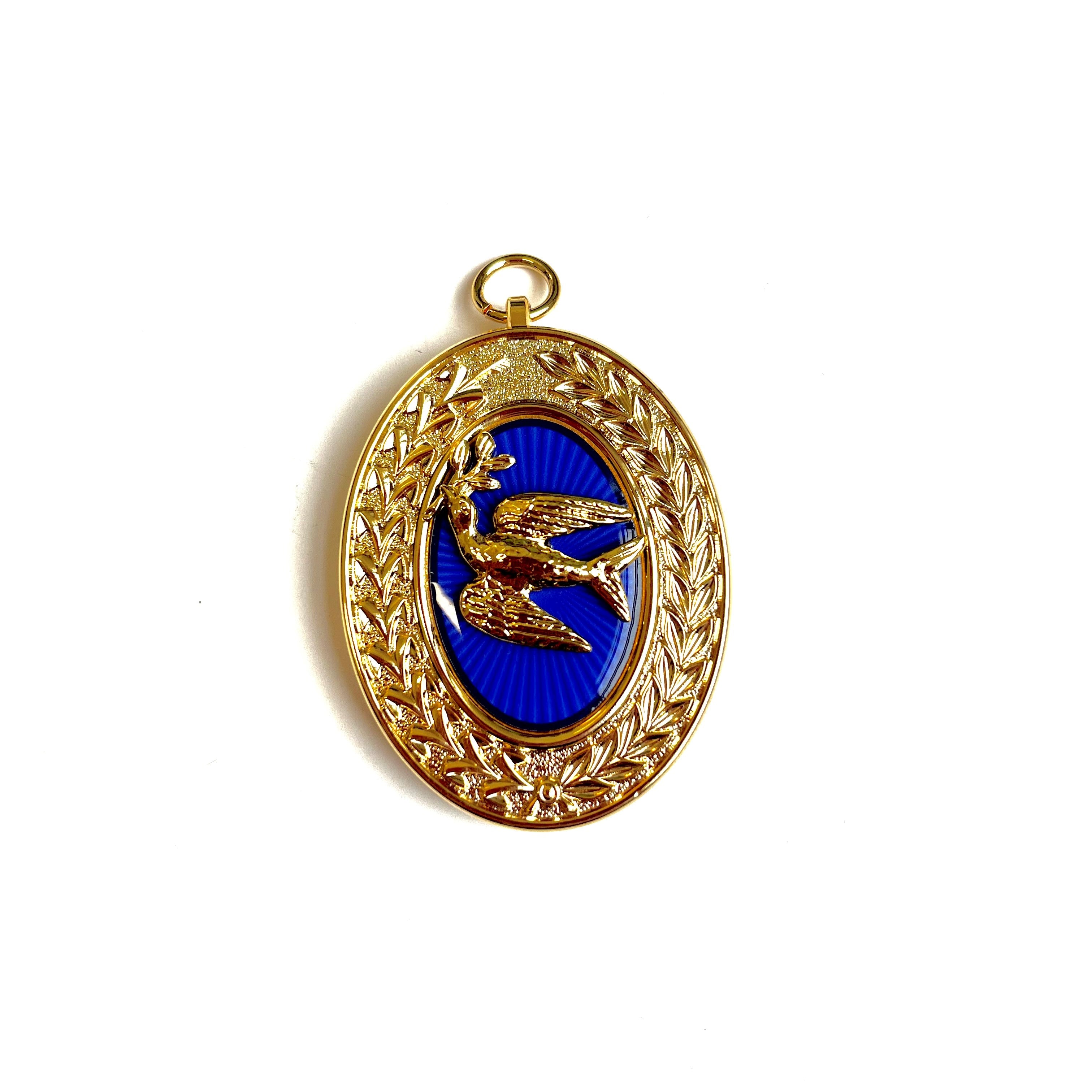 A Masonic gold and blue collar jewel featuring an bird motif with intricate border design.