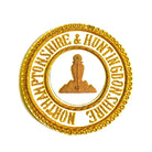 A gold-colored apron badge with embroidered text and a symbol in the center.