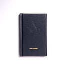 A Masonic Emulation 1st Degree closed hardcover book with a leather binding and embossed lettering on the cover, titled 'FIRST DEGREE'.