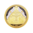 A hand-painted collectable coin with Freemasons' Hall, London depicted on one side and the square & compasses design on the reverse, predominantly gold and silver in color.