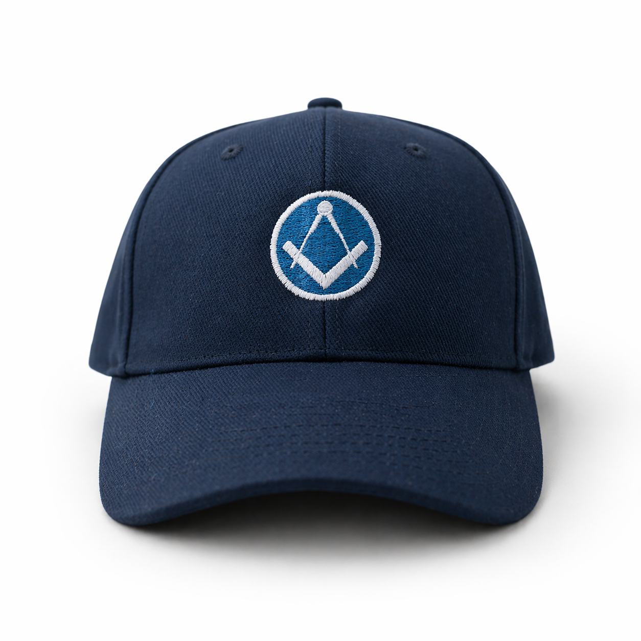 Front view of navy blue baseball cap with a curved brim, featuring an embroidered Masonic square-and-compass symbol in white and light blue on the front.