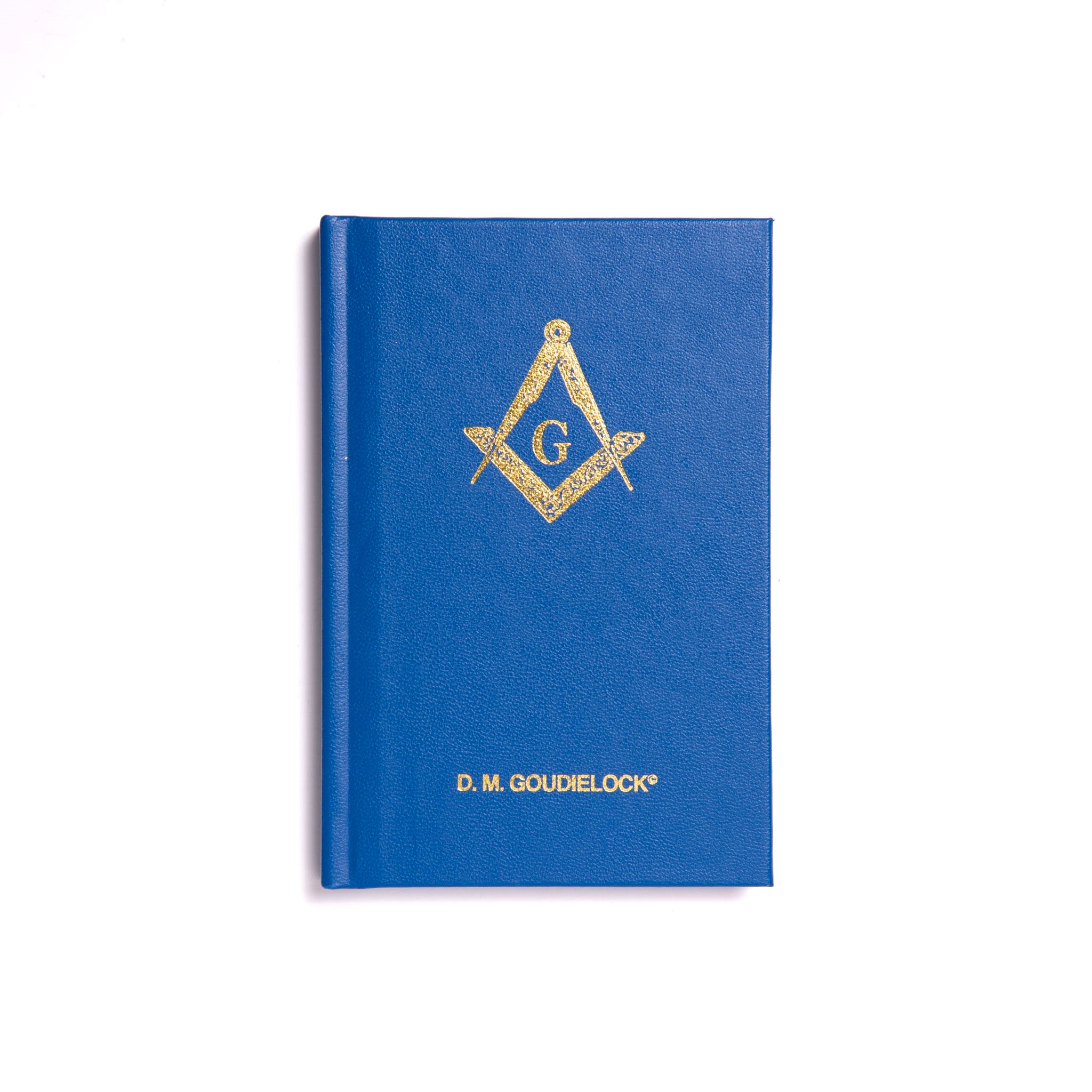 A hardback book with a blue cover featuring a gold emblem of the Freemasonry symbol.