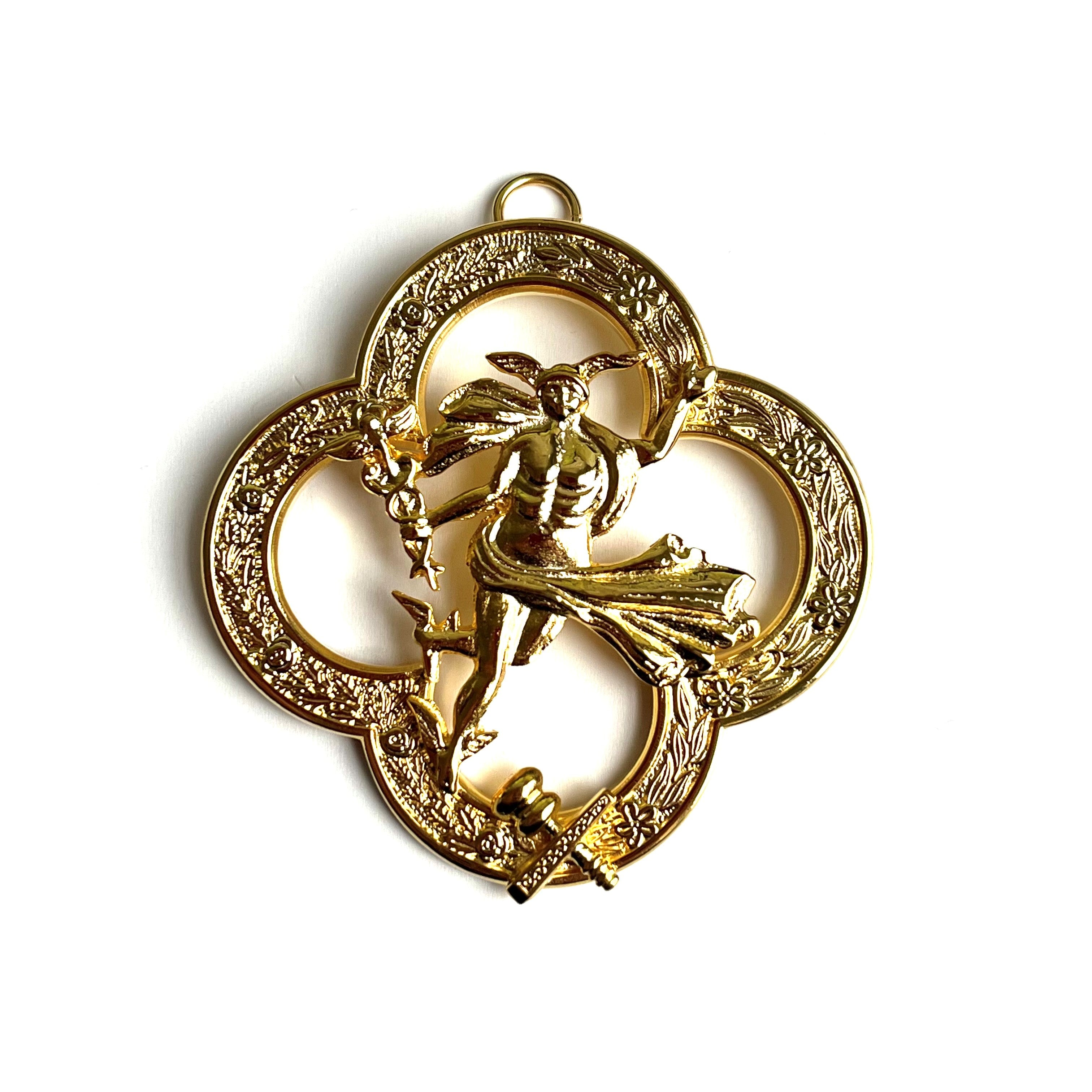 Gold Masonic jewel with intricate design on a white background