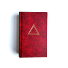 It is found masonic Royal Arch ritual Red book with a gold triangle on a white background