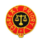 A Knight Malta Great Priory Mantle Badge circular badge featuring a black and orange color scheme, with gold trim and the text 'GREAT PRIORY' prominently displayed.
