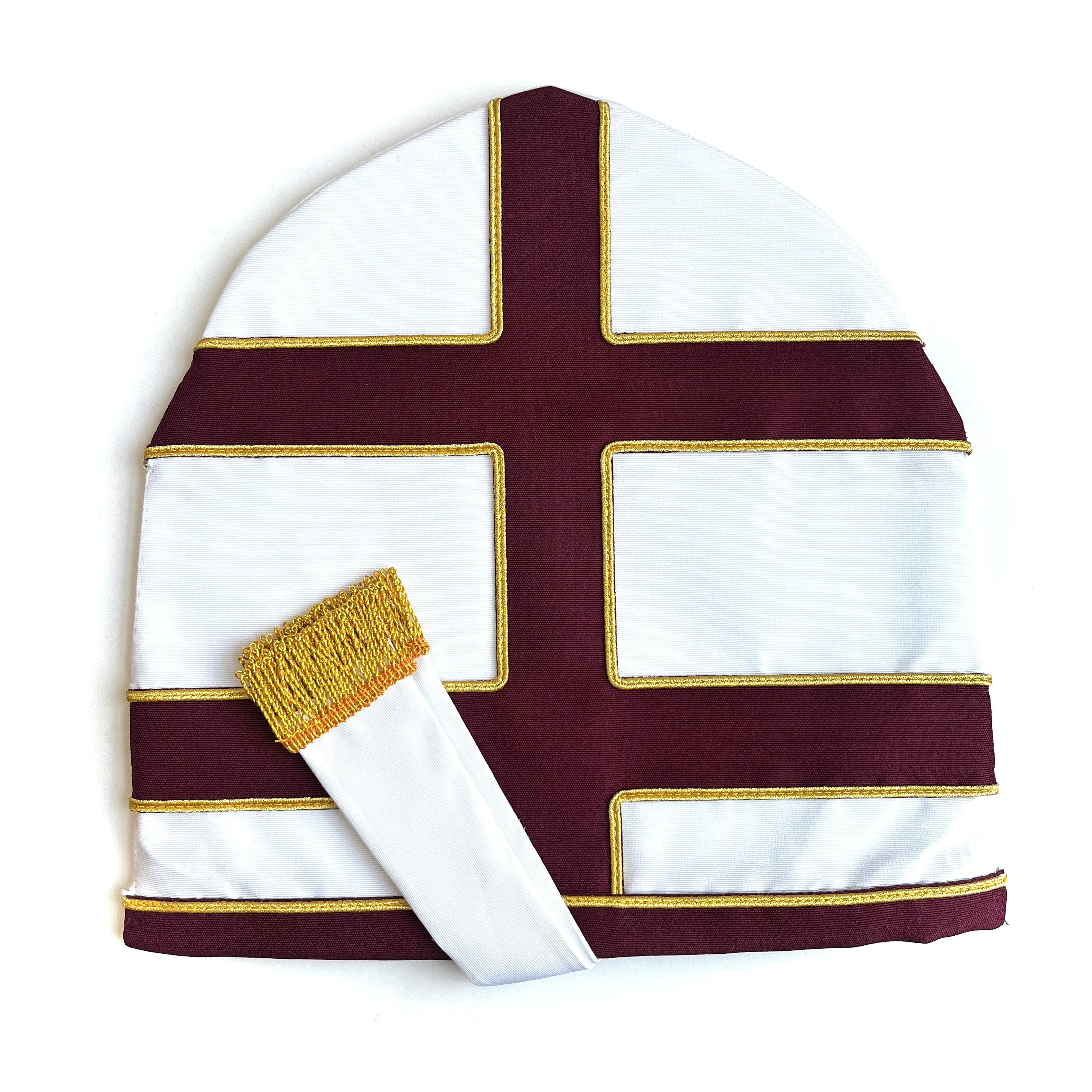A mitre, traditionally worn by High Priests in Tabernacle, with white and purple colors and gold trim.