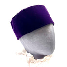 A purple Masonic hat with a red cross on a mannequin head.