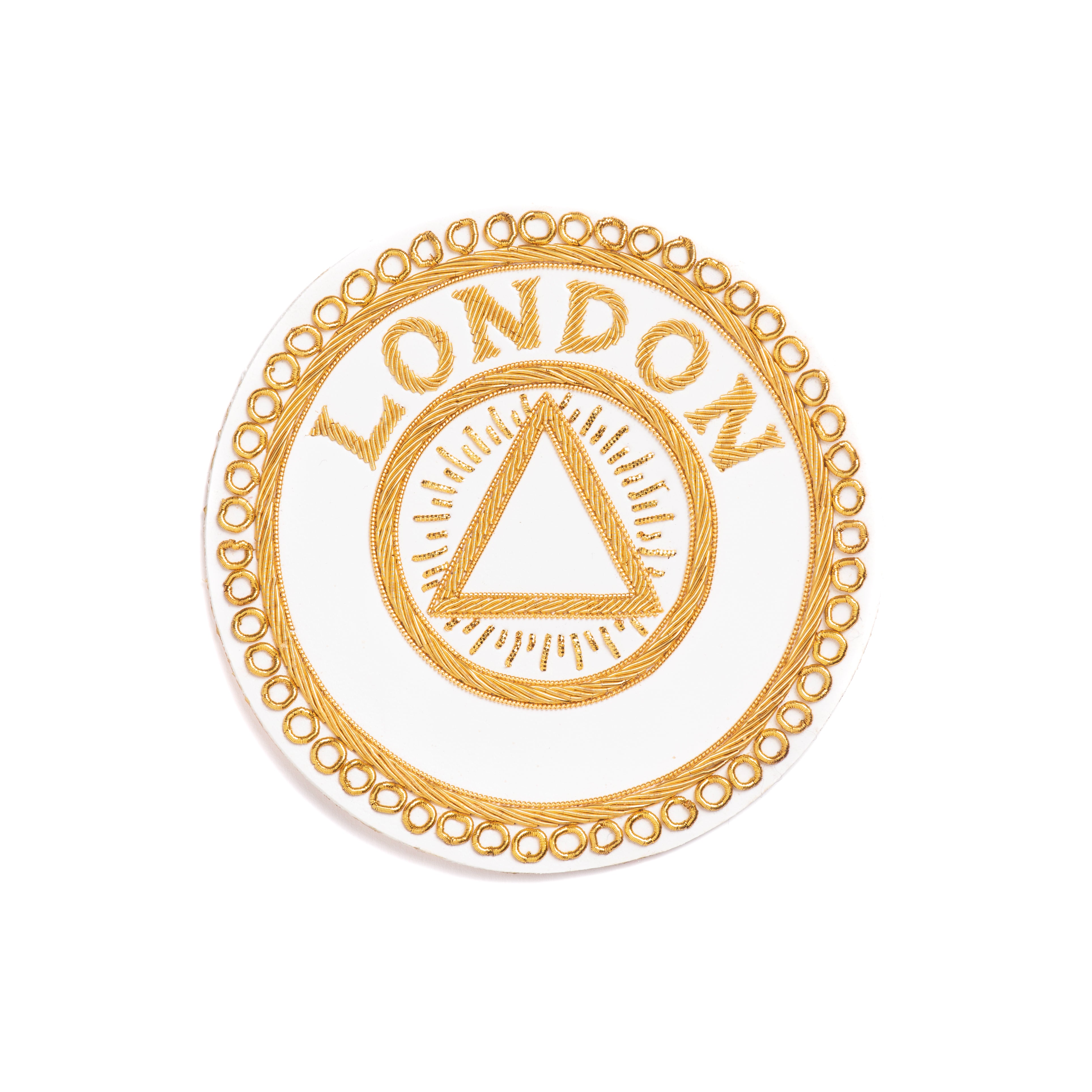A gold-colored Masonic apron badge featuring the word 'LONDON' along with a Masonic emblem, encircled by a decorative border.