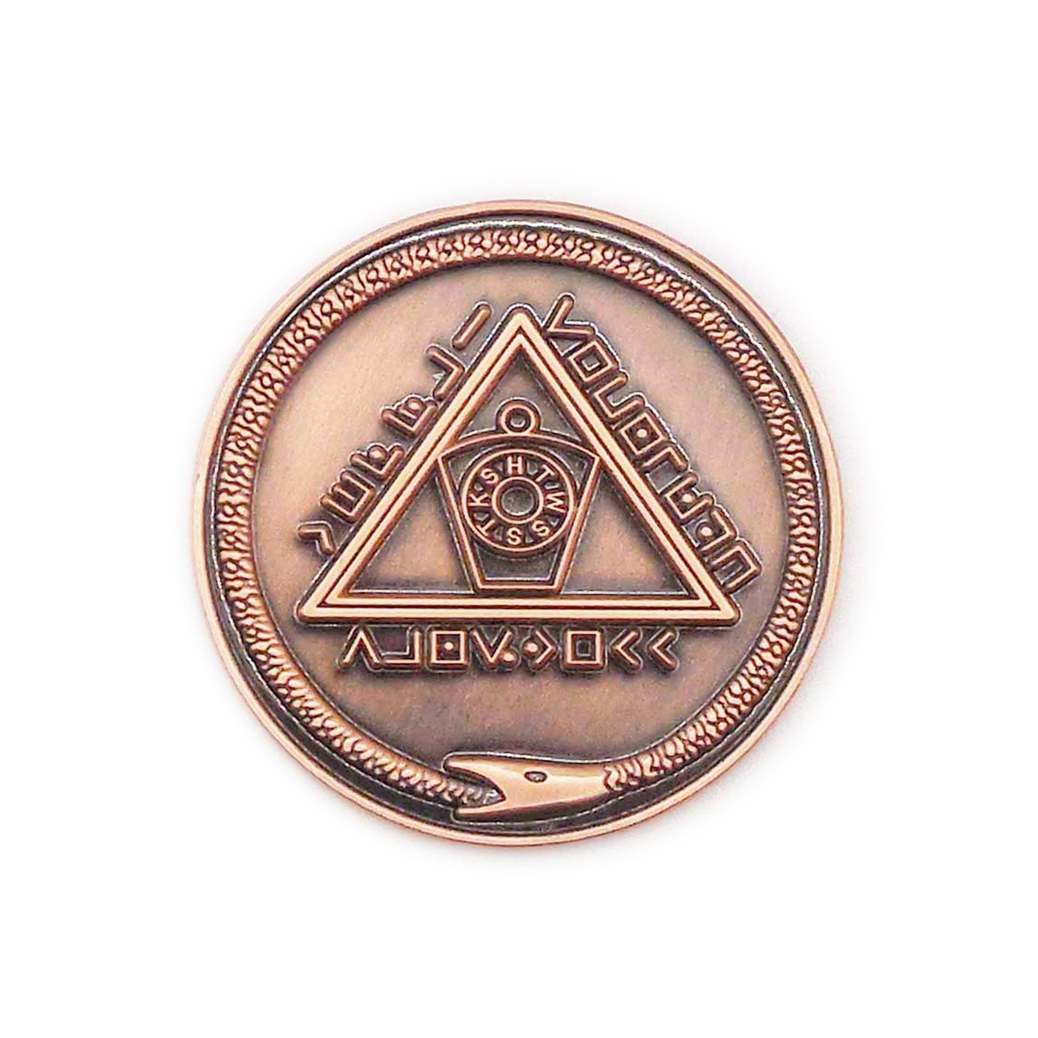 A bronze-coloured round Masonic metal token with engraved symbols and text related to Masonic lodge.