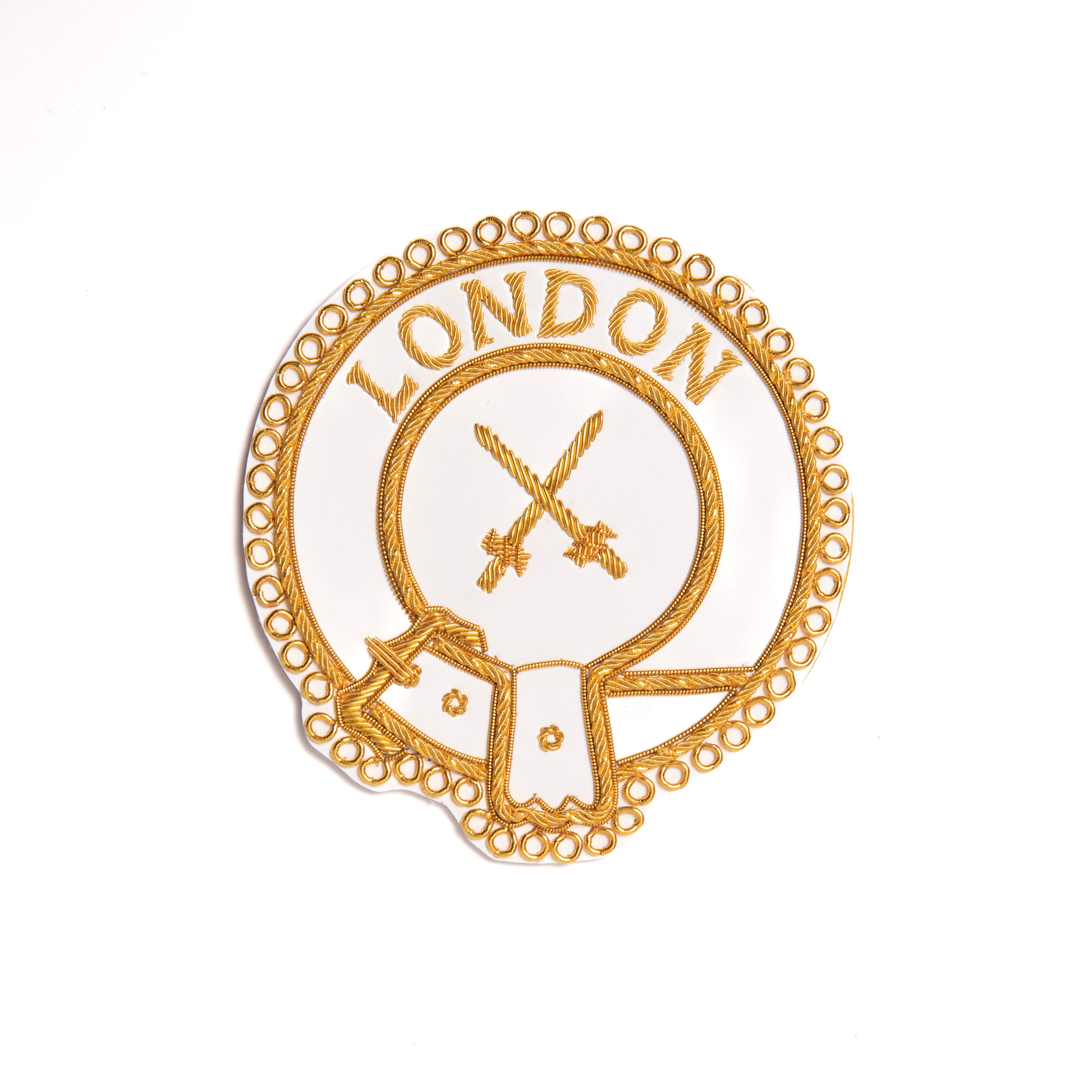 A gold-colored apron badge with the word 'LONDON' and an emblem embroidered on it, without adhesive backing.