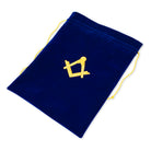 A large Masonic blue velvet alms bag with a yellow drawstring and a gold Masonic square & compasses symbol printed on the front.