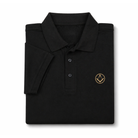 Folded black polo shirt with a collar and button placket, featuring a small gold embroidered Masonic square-and-compass symbol on the chest.