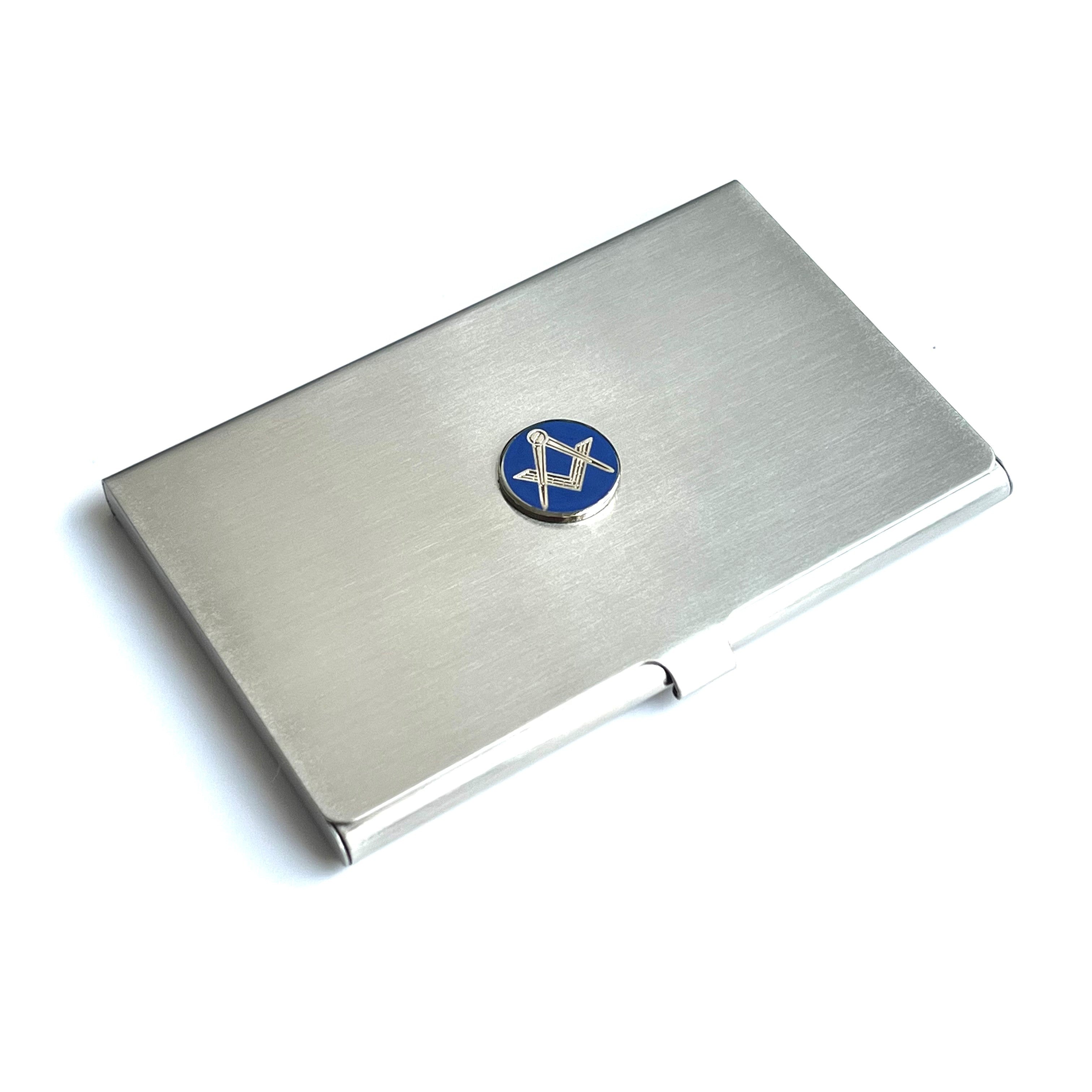 Masonic silver business card holder with a blue square & compasses emblem on a white background