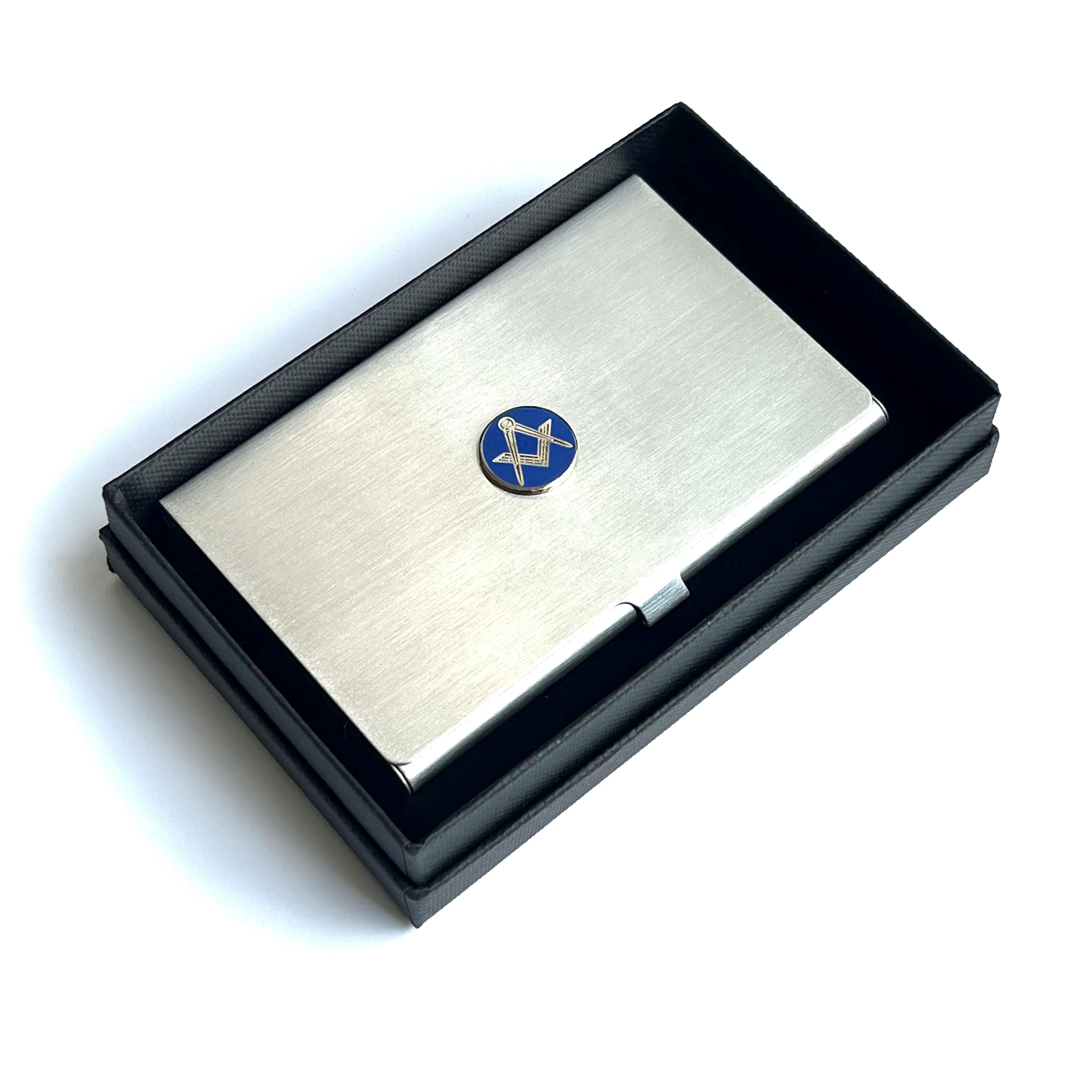 Metallic cardholder in a black gift box with a blue masonic square & compasses emblem on a white background