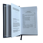 Open book showing a table of contents on a white background