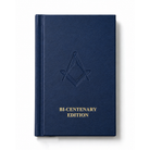 Blue ritual book with Masonic emblem and 'Bi-Centenary Edition' text on a white background