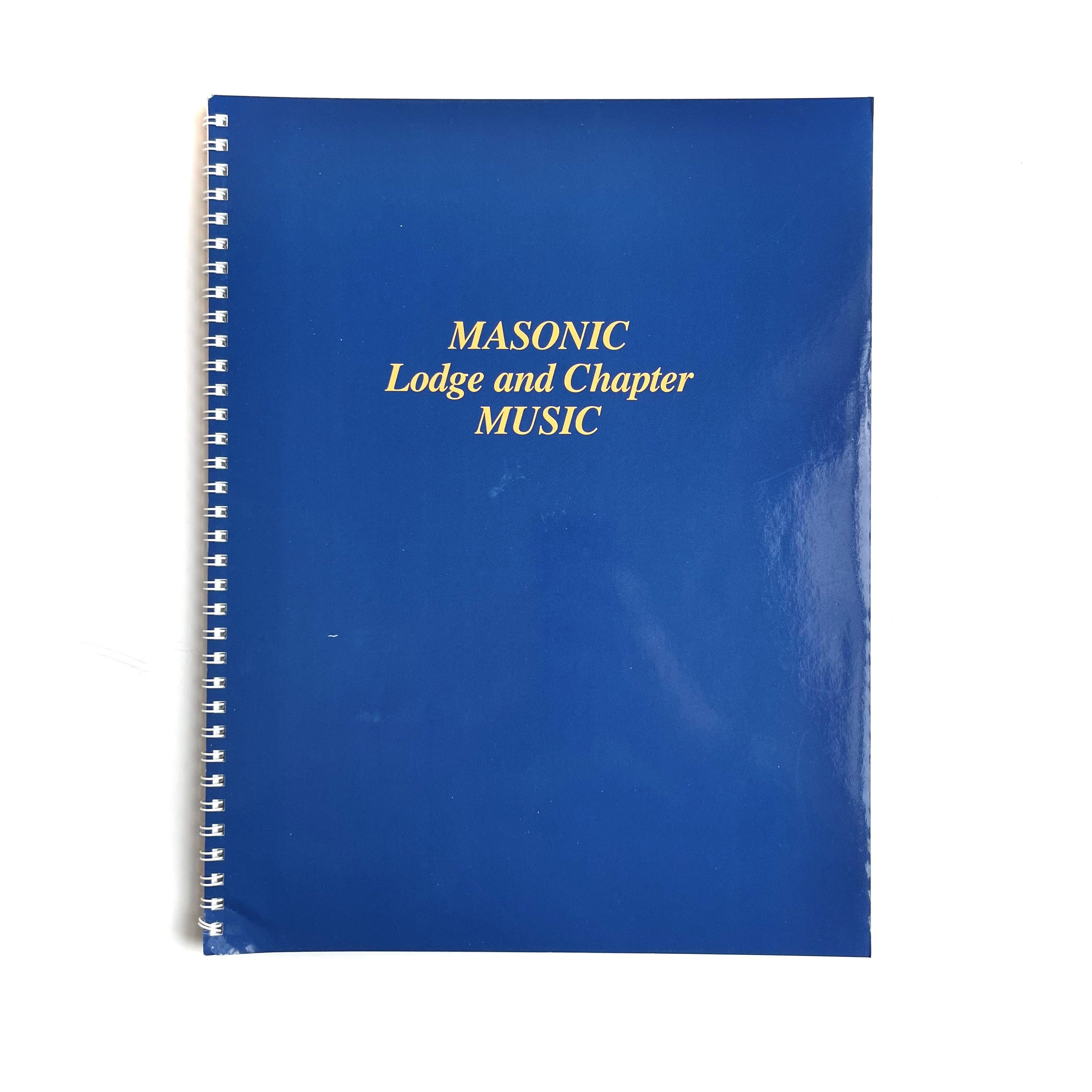 A blue-covered spiral-bound sheet music book titled 'Masonic Lodge And Chapter Music'.