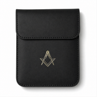 Black premium leather car key pouch with gold Freemasons' square & compasses emblem on a white background
