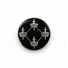 A Masonic Quatuor Coronati Lapel Pin Badge with a black and white geometric design, featuring a plated finish with silver coloured details.